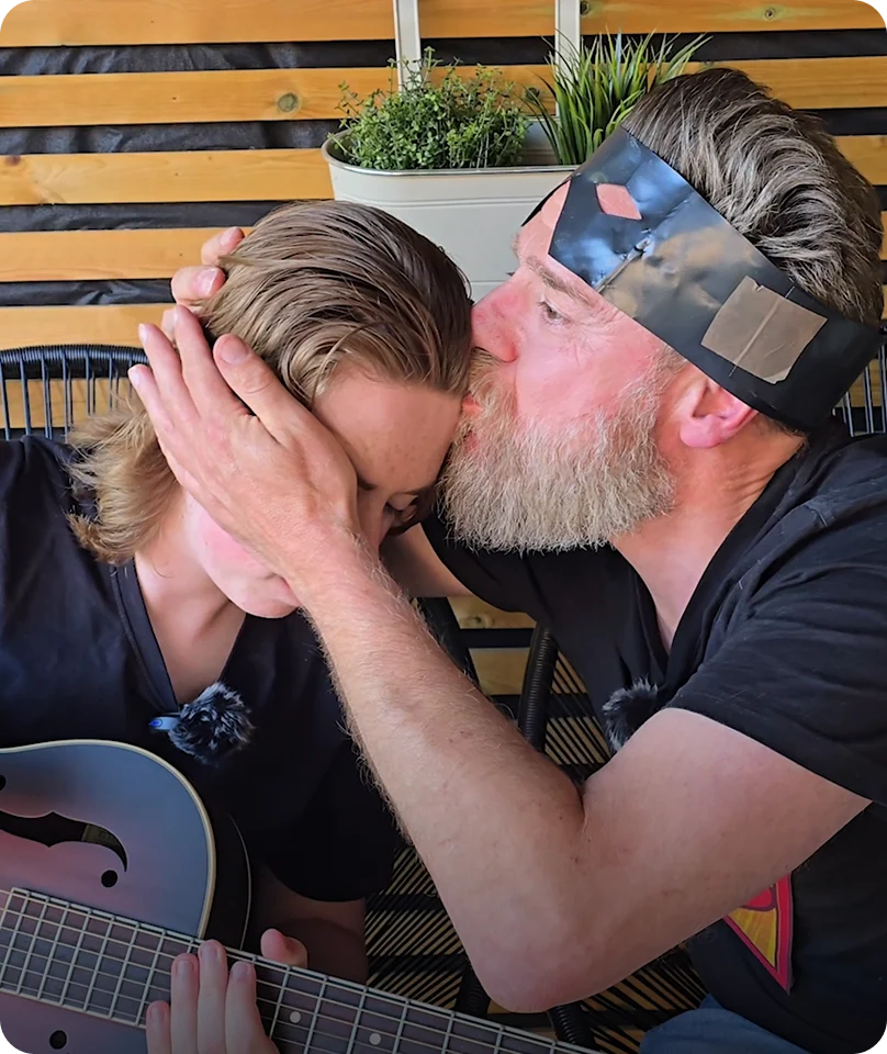 Anker with man holding head for guitar performance